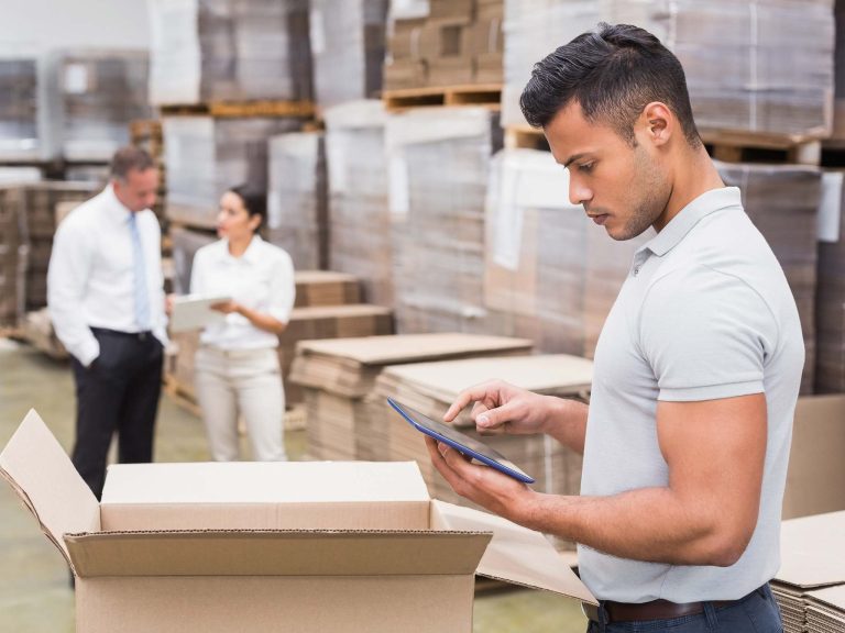 male-manager-using-digital-tablet-in-warehouse